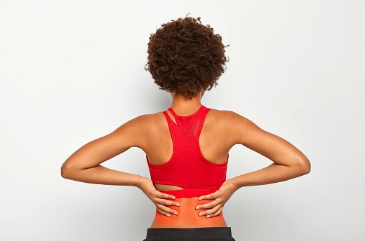 Active Woman Exercising With Lower Back Pain